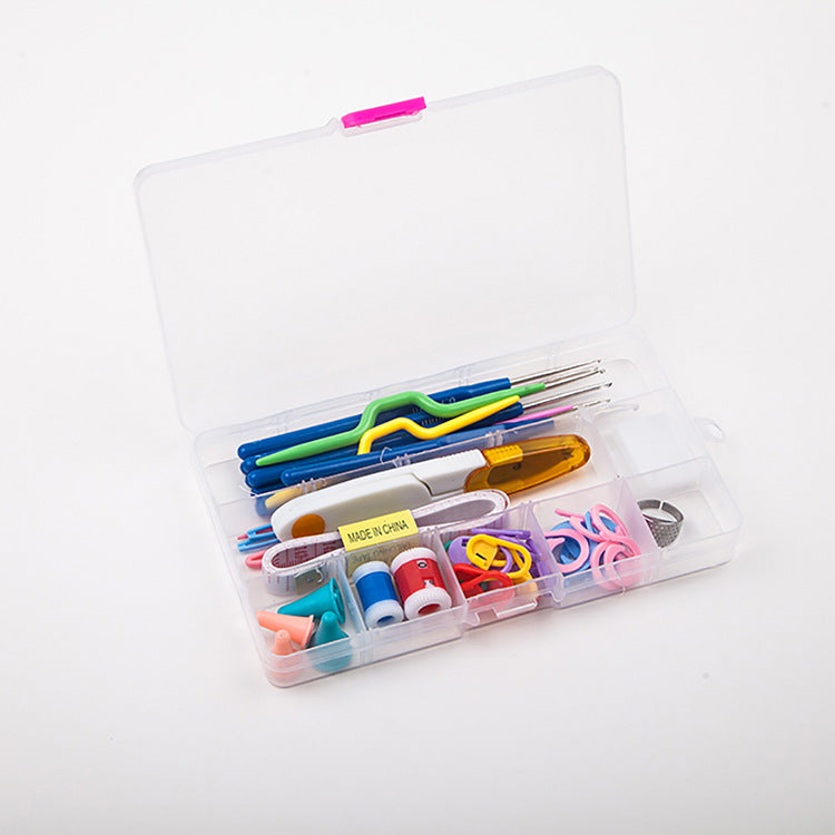 Open storage box containing crochet hooks and small accessories