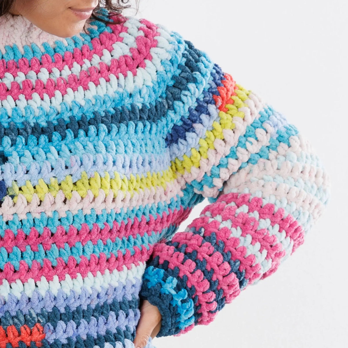 Close-up of the crochet pullover neckline and color-changing stitches