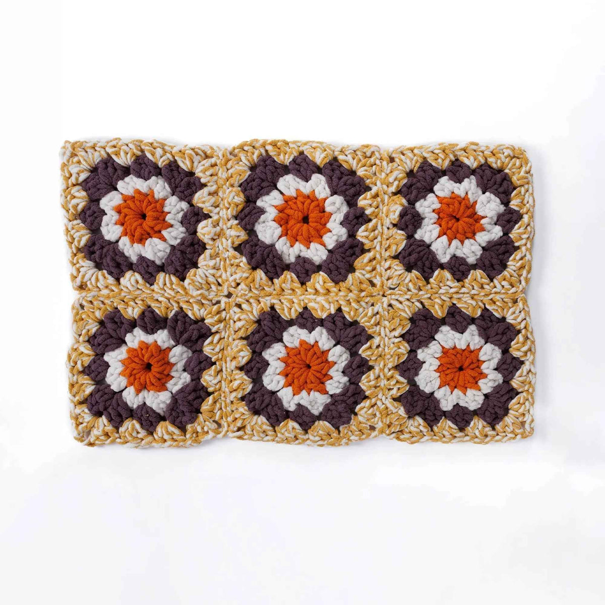 Six-square granny crochet blanket spread flat