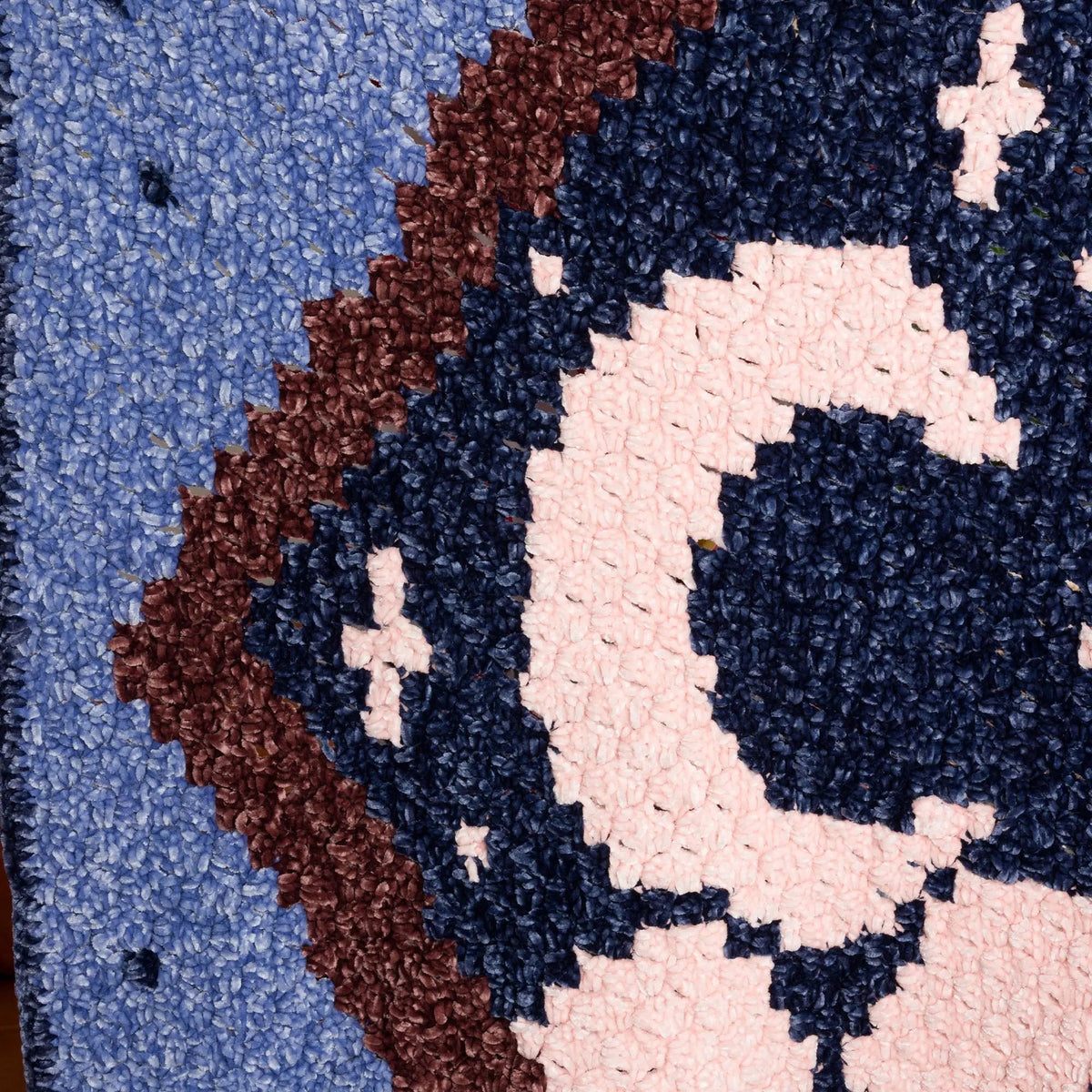 Close-up of the crescent moon against dark blue crochet
