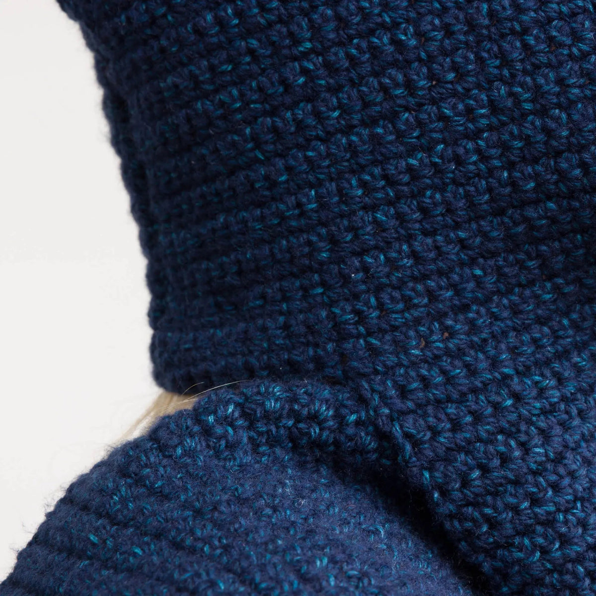 Close-up of navy crochet hood and scarf stitches