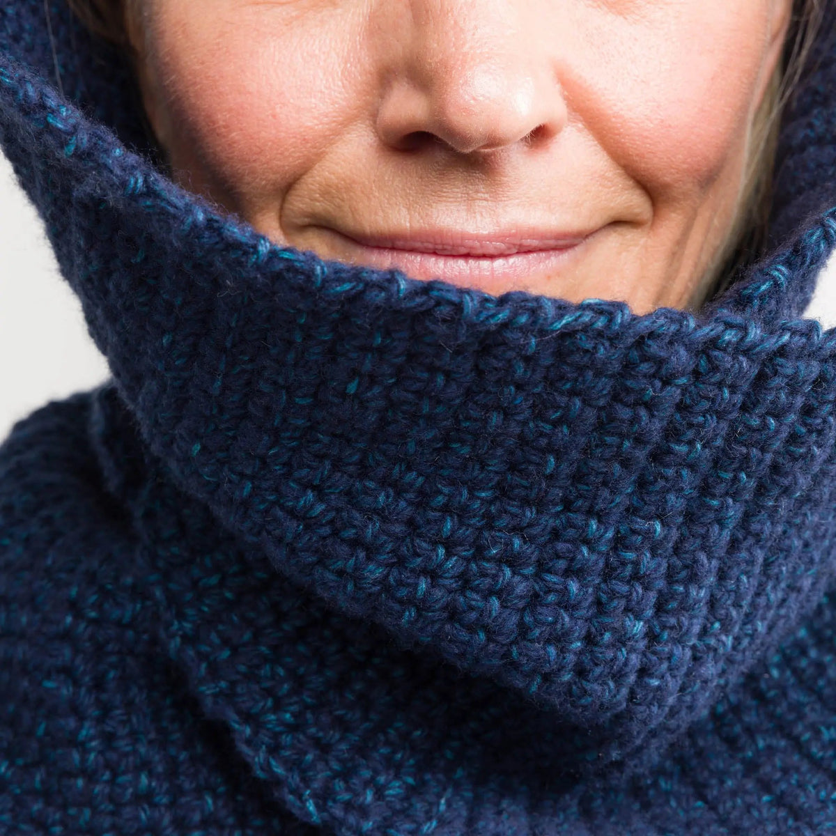 Close-up of the scarf around the model’s neck