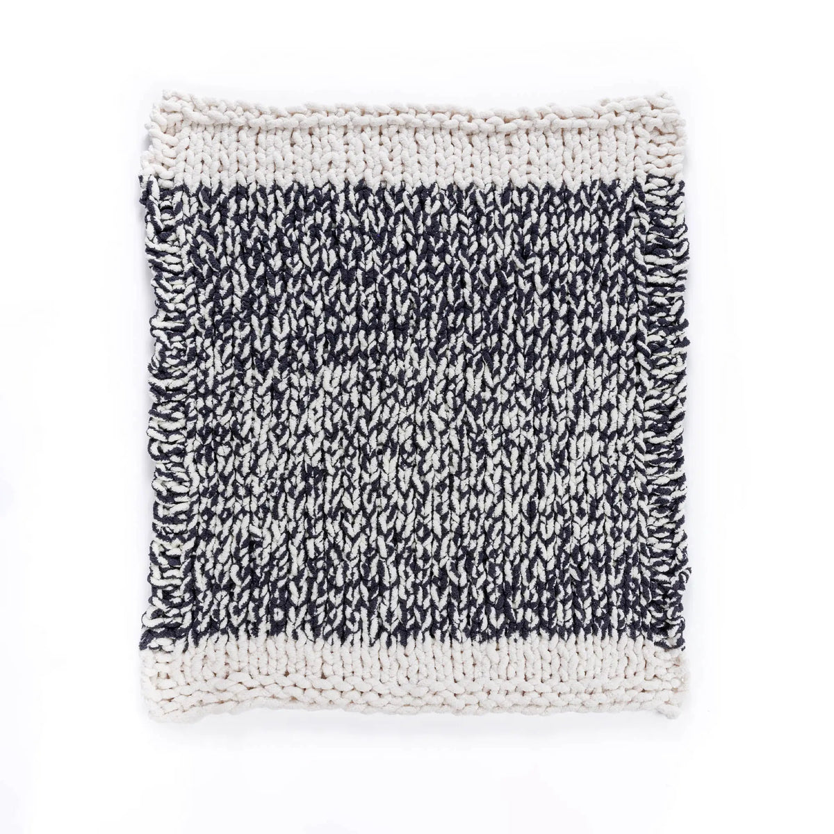 Go With the Flow knit blanket laid flat with cream edge stripes
