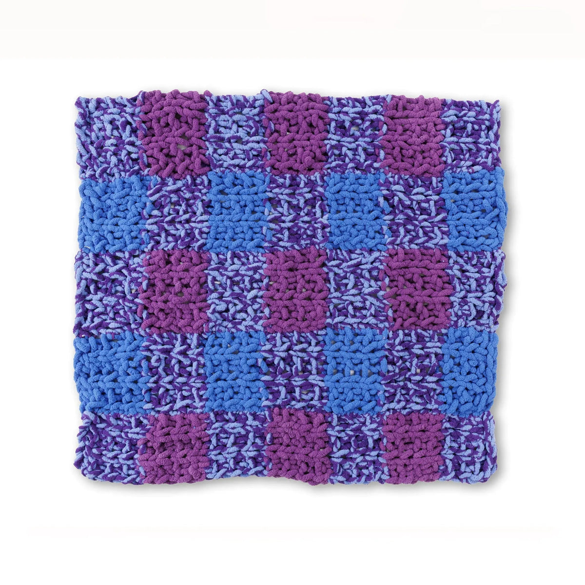 Gingham knit blanket laid flat showing colorblocked panels