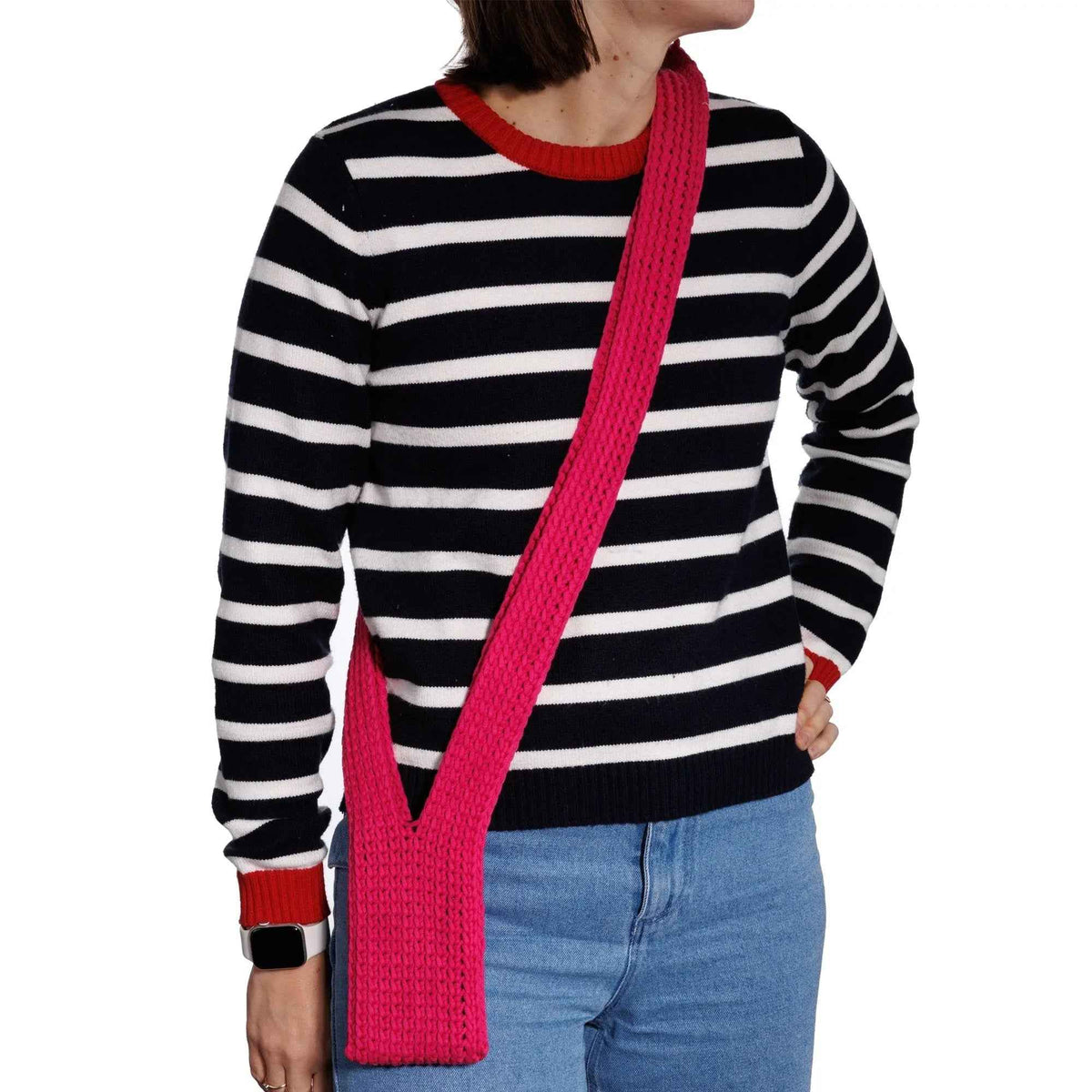 Model wearing the long pink Fruit Loop crochet phone pouch