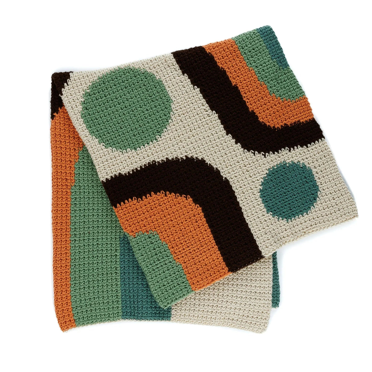 Folded crochet blanket with cream, green, orange and brown colorwork