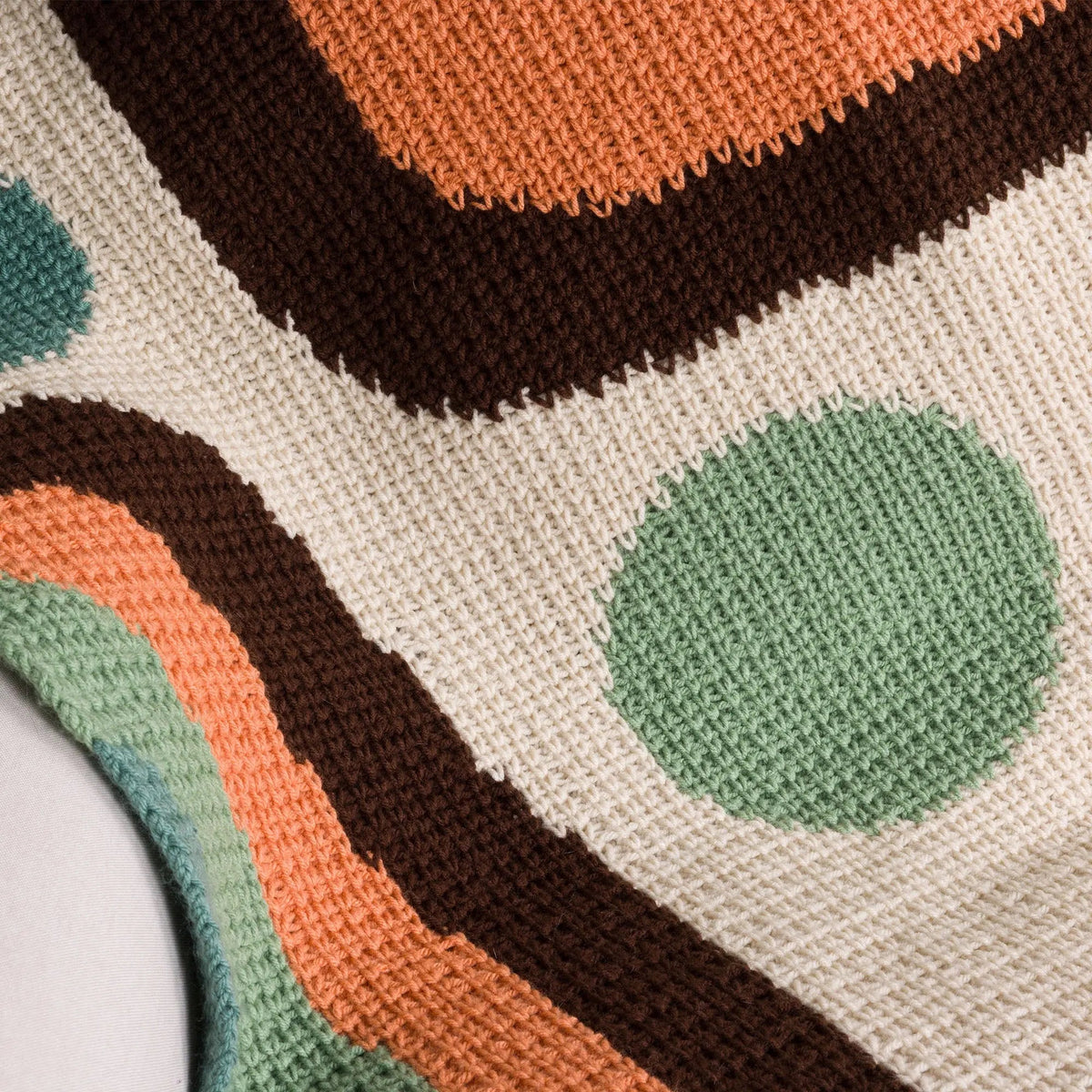 Detail of green circle motifs and contrasting crochet colorwork