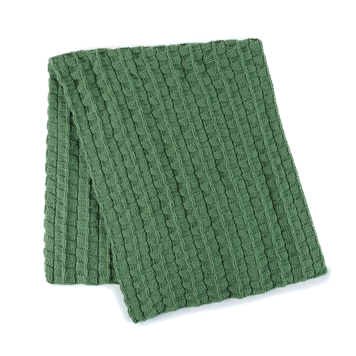 Folded green textured knit blanket