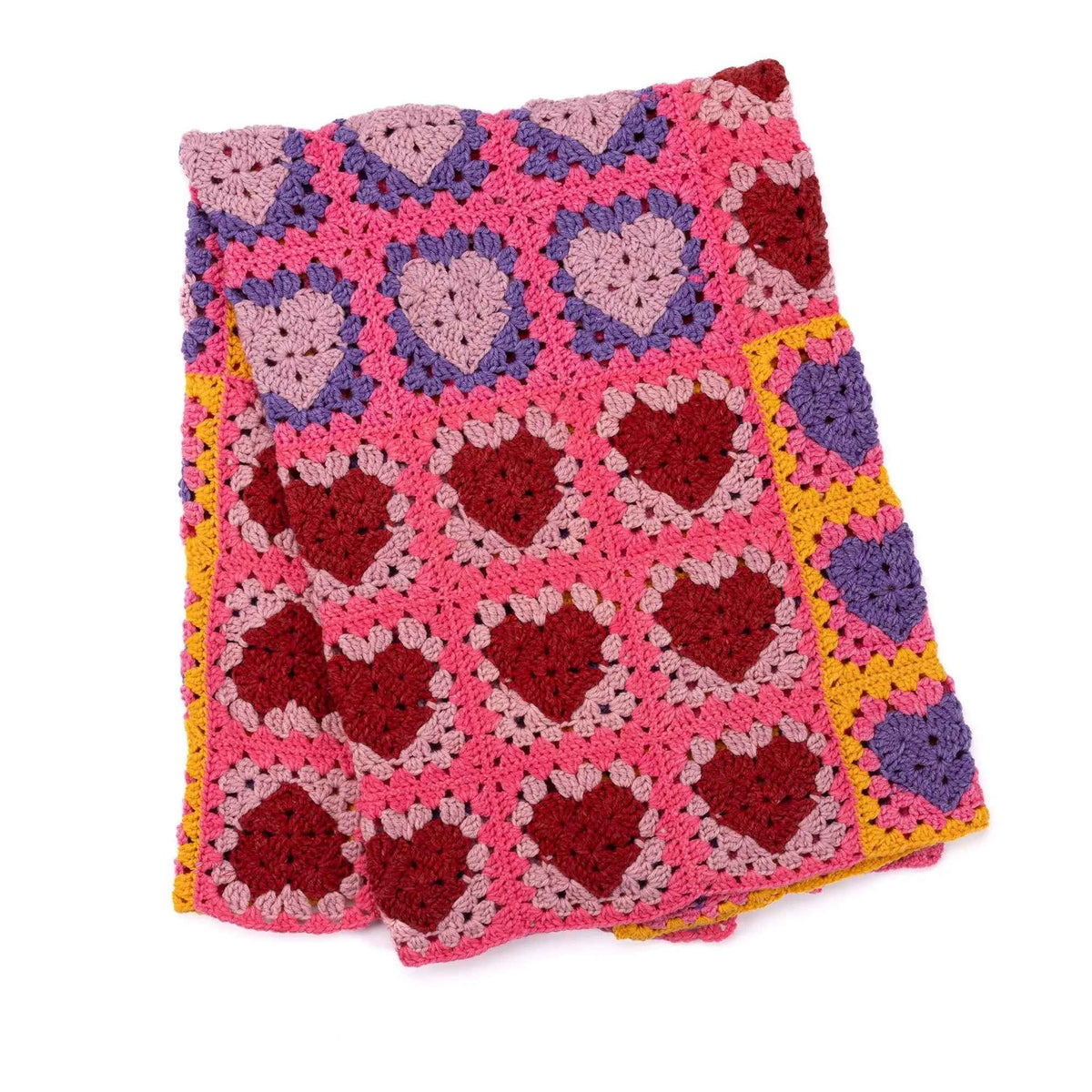 Folded Lots O Love blanket with pink, purple and red heart squares