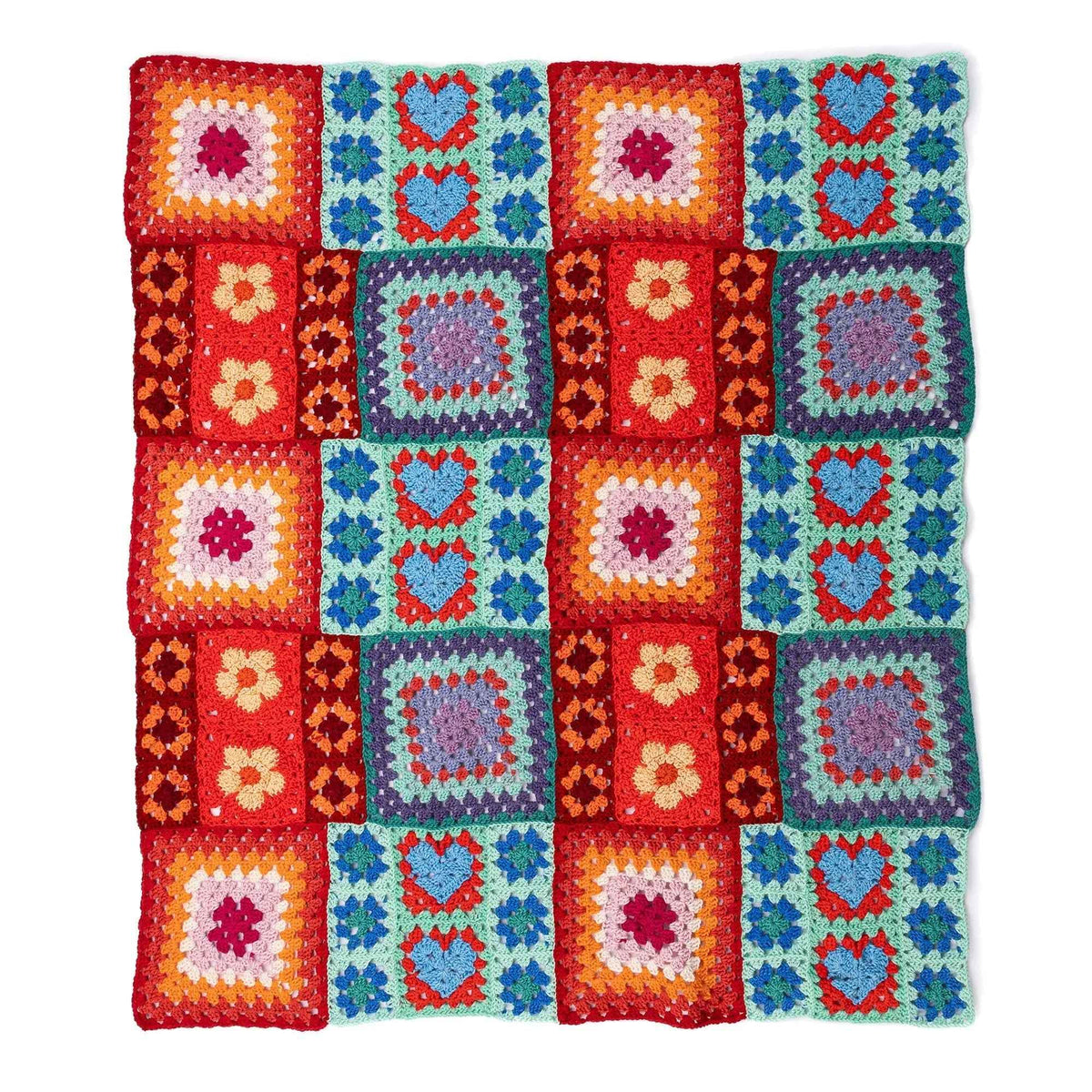Crochet blanket laid flat with hearts, flowers and granny squares