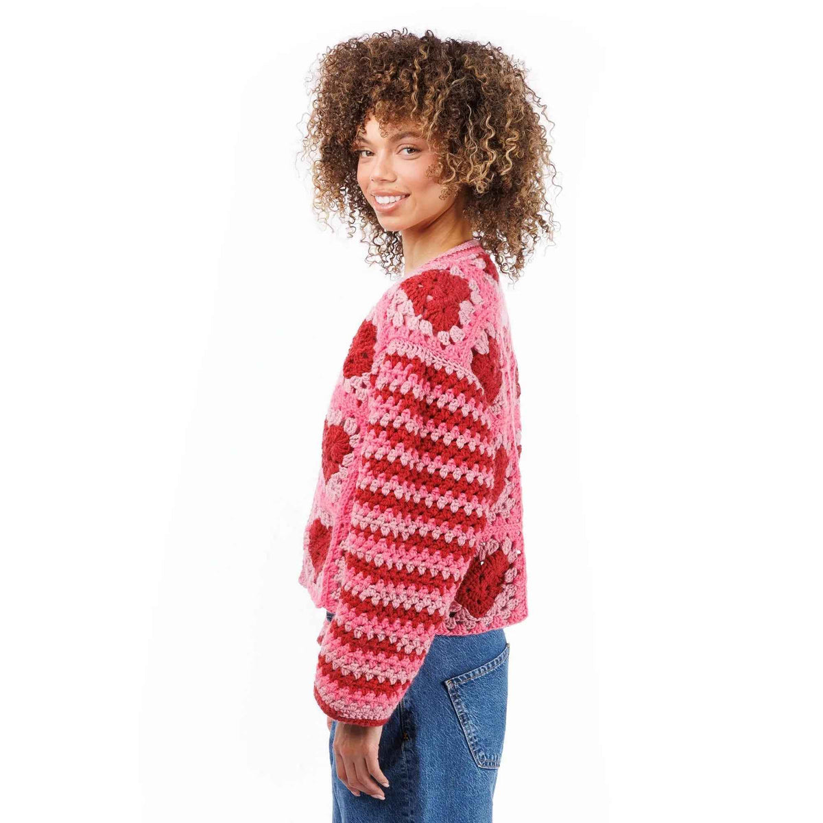 Side view of pink heart-motif cardigan