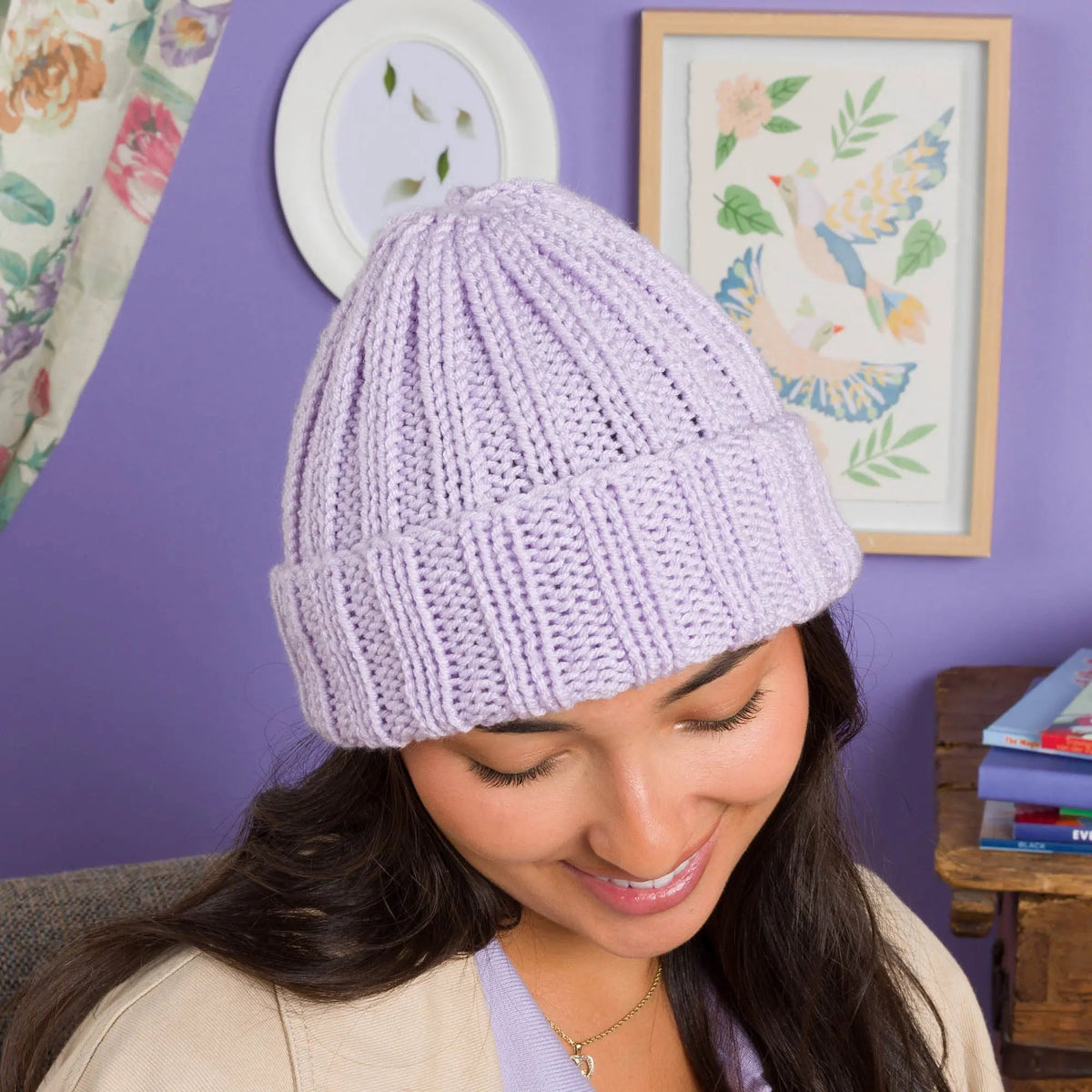 Model wearing a lavender ribbed knit hat