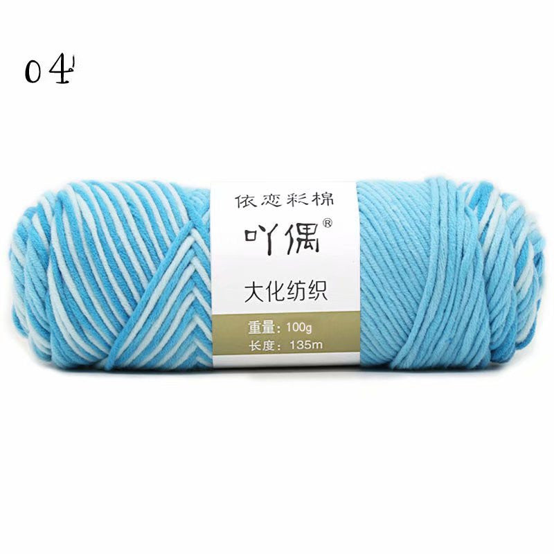 Light blue and white yarn skein with a paper label
