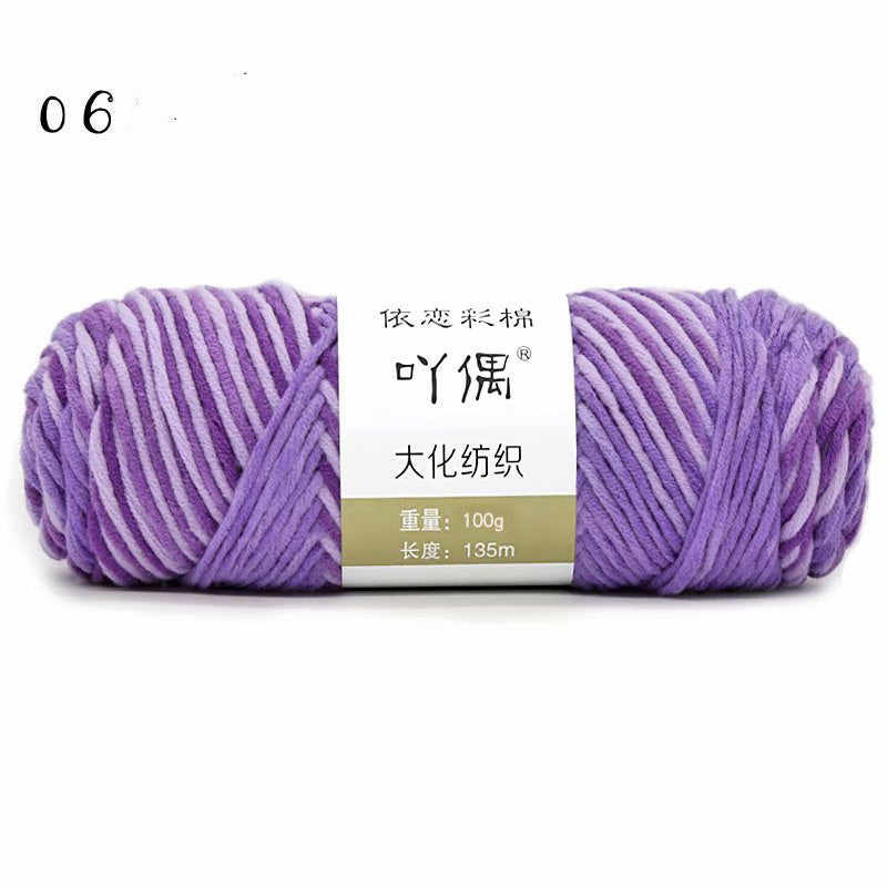 Lavender and white yarn skein with a paper label