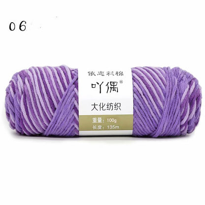 Lavender and white yarn skein with a paper label