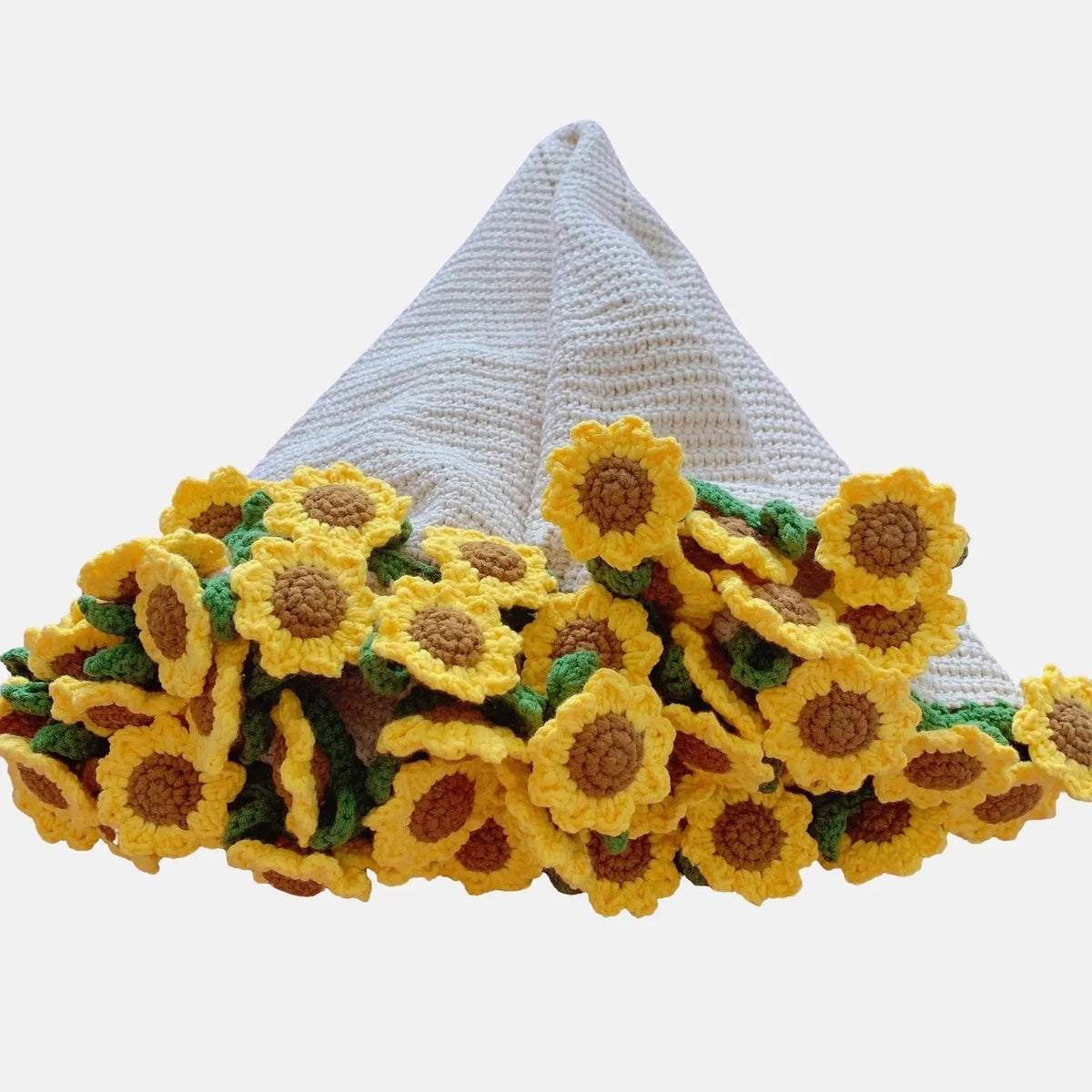 White crochet blanket gathered with sunflower edging