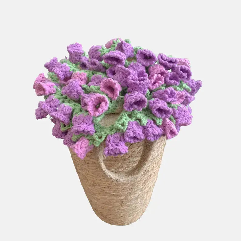 Purple flower-edged crochet blanket folded into a bouquet