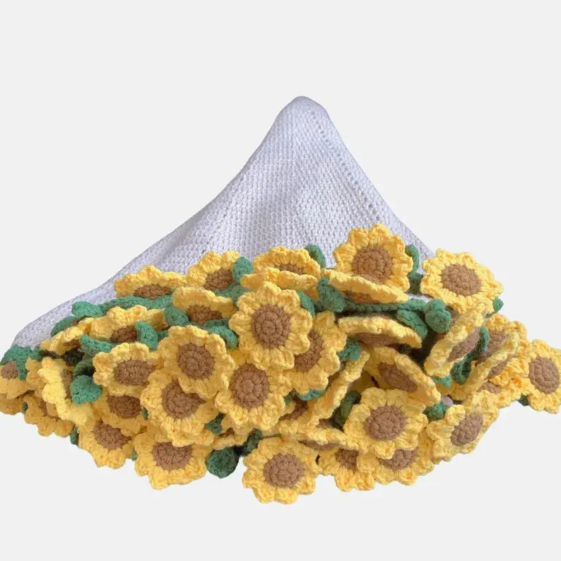 Yellow flower-edged crochet blanket gathered into a bouquet