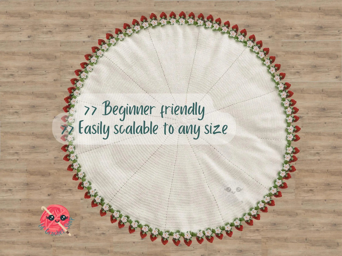 Strawberry-edged crochet blanket spread flat
