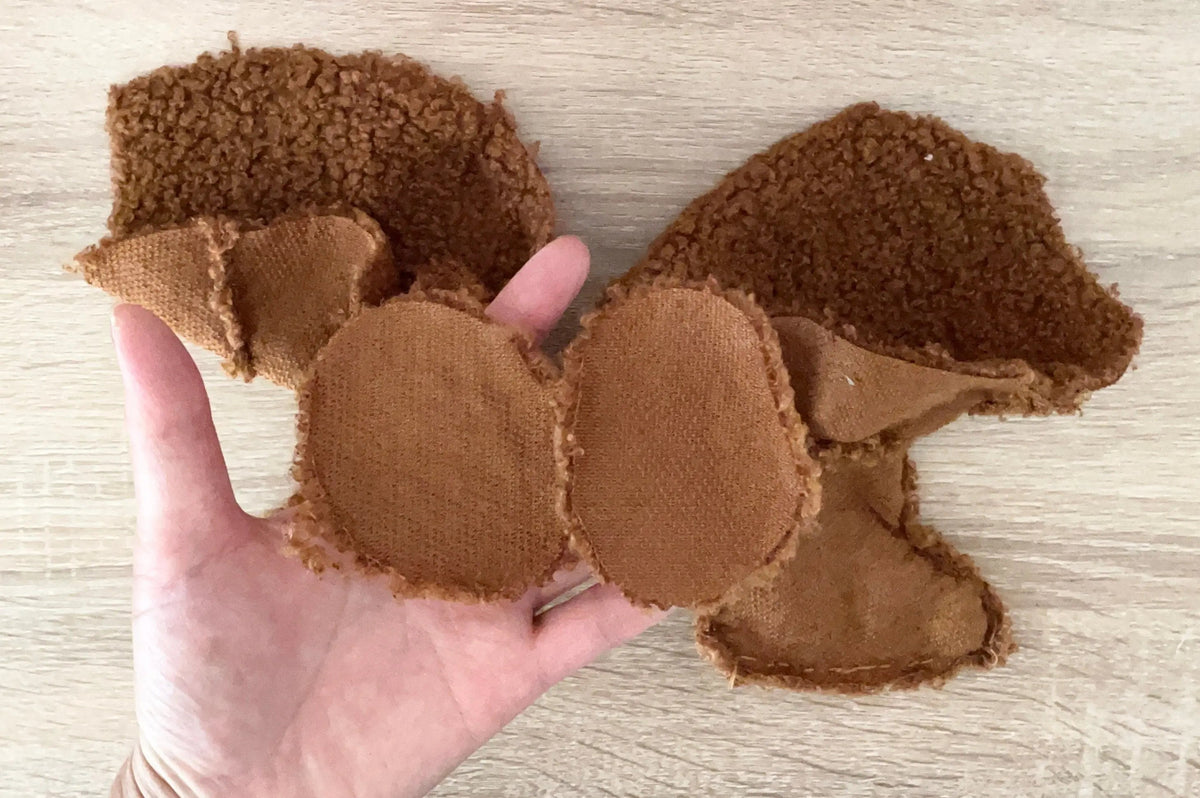 Separate sewn teddy bear body and limb pieces